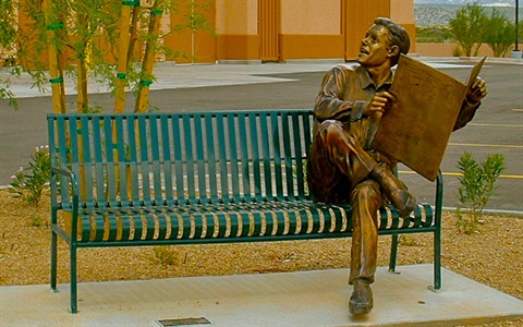 Morning Paper bronze sculpture of man on bench