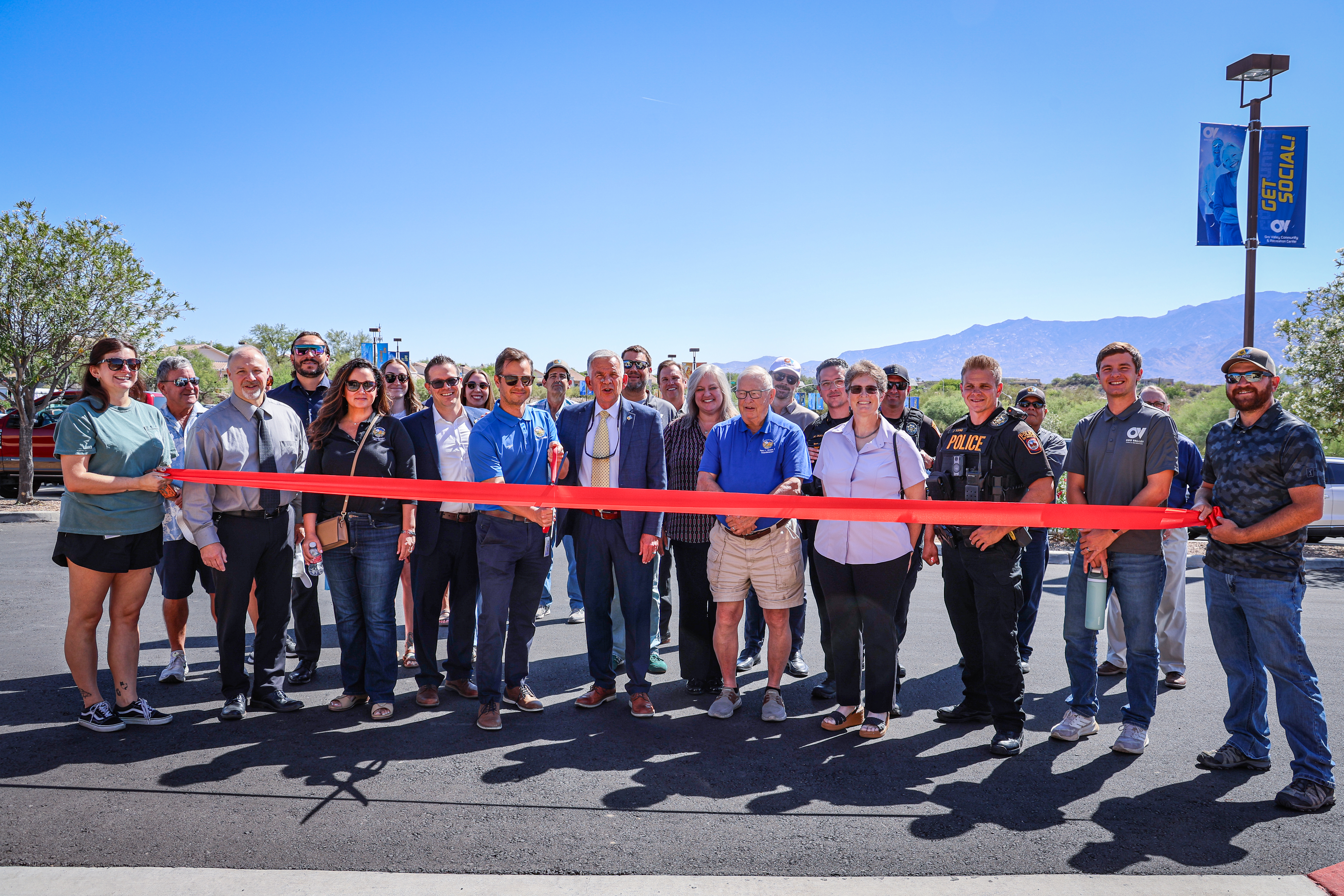 Group photo of ribbon cutting at CRC parking lot